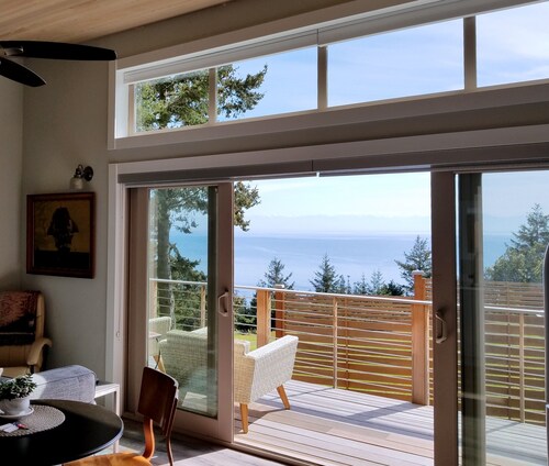 Spectacular West side views of Strait, Olympics, Victoria, south to Mt Rainier.
