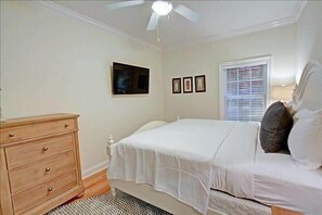 A bedroom with a bed, dresser, and a ceiling fan. - Golf Cart & 4 Bikes! Walk to the Beach & the Pool! One Story Home in Gated Comm! ~ Our Little Peace of Paradise at Destiny West (Destin)