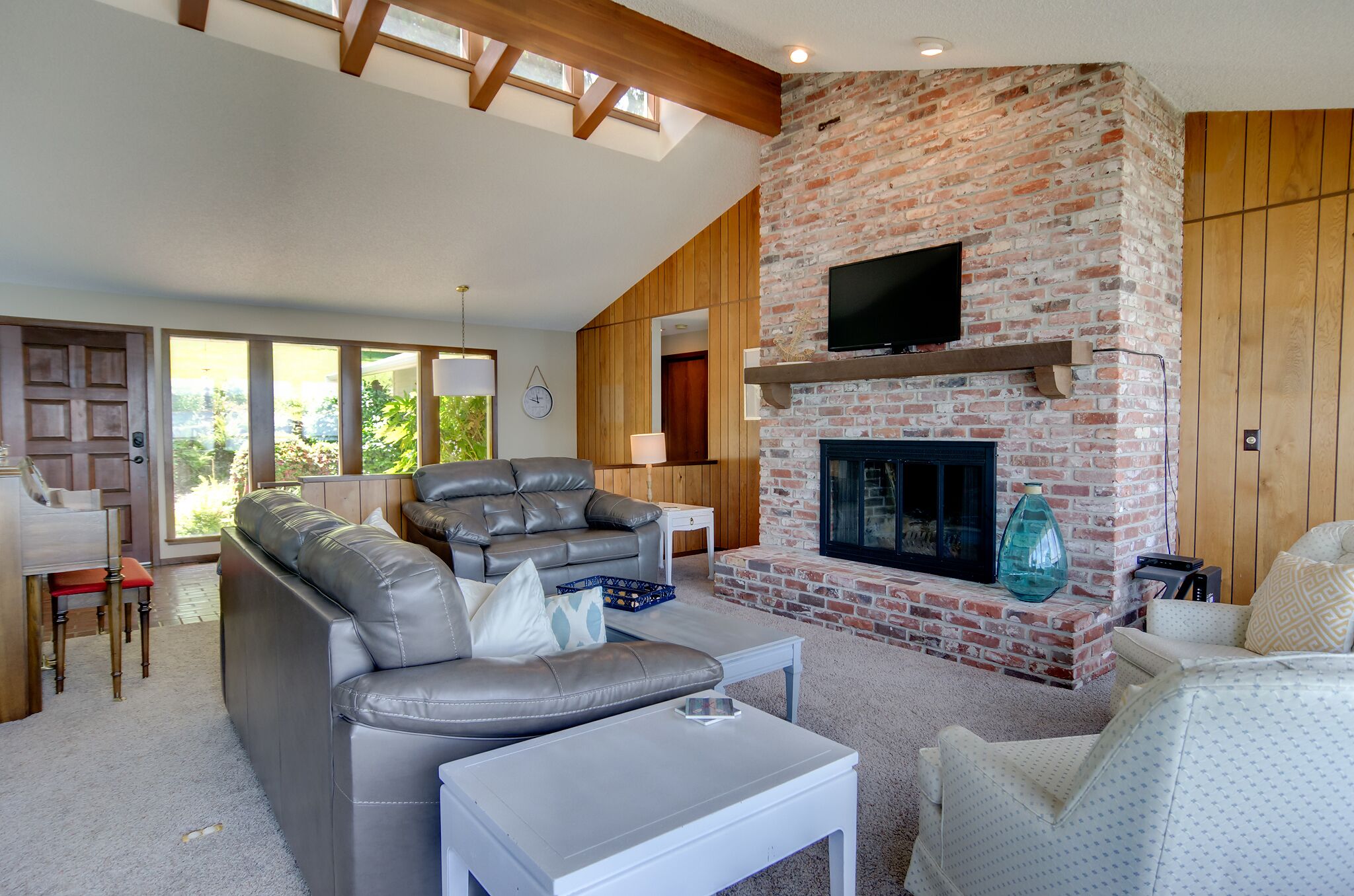 Panoramic views of the Olympic Mtns, waterfront beach and paddleboards