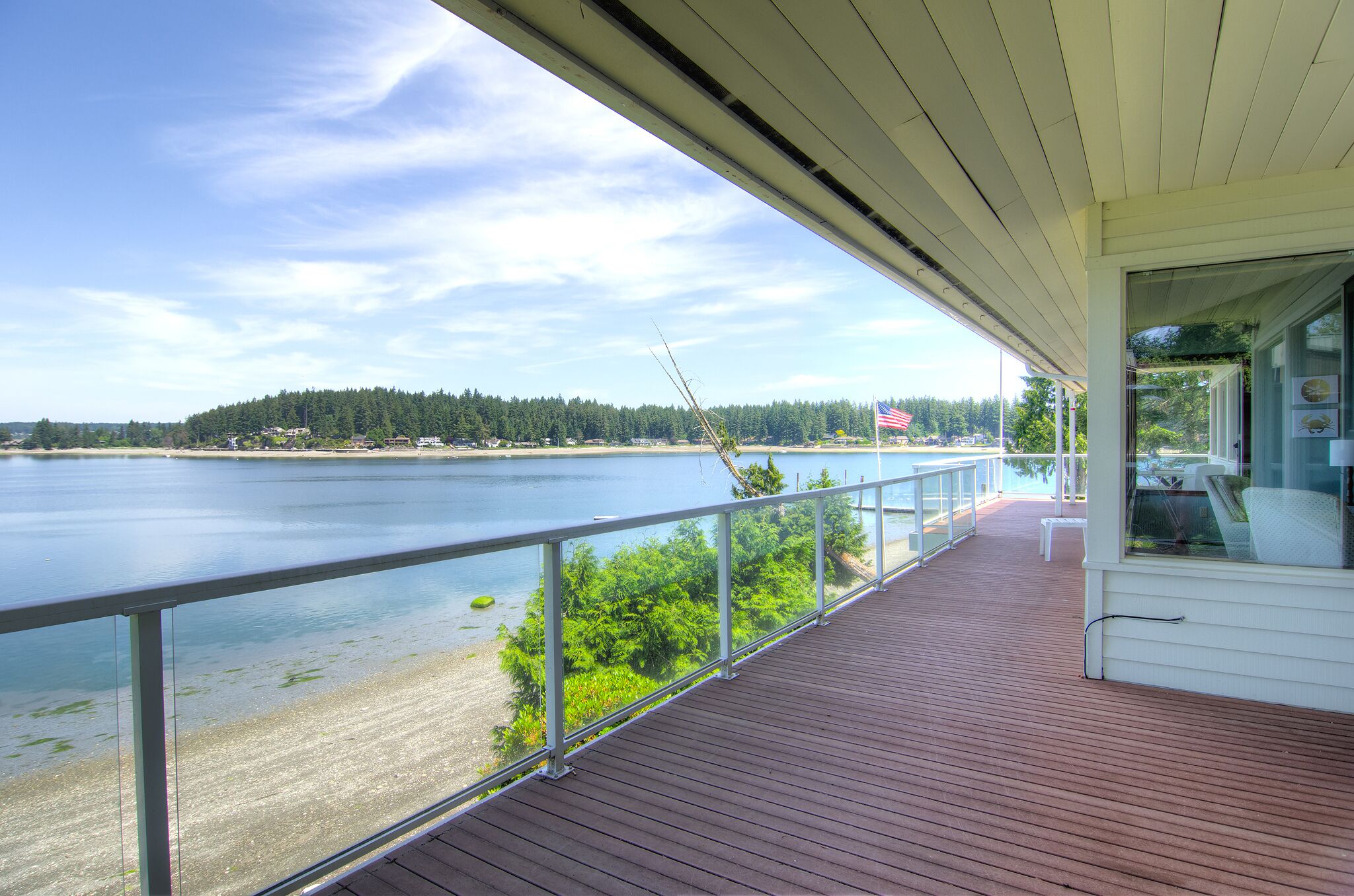 Panoramic views of the Olympic Mtns, waterfront beach and paddleboards