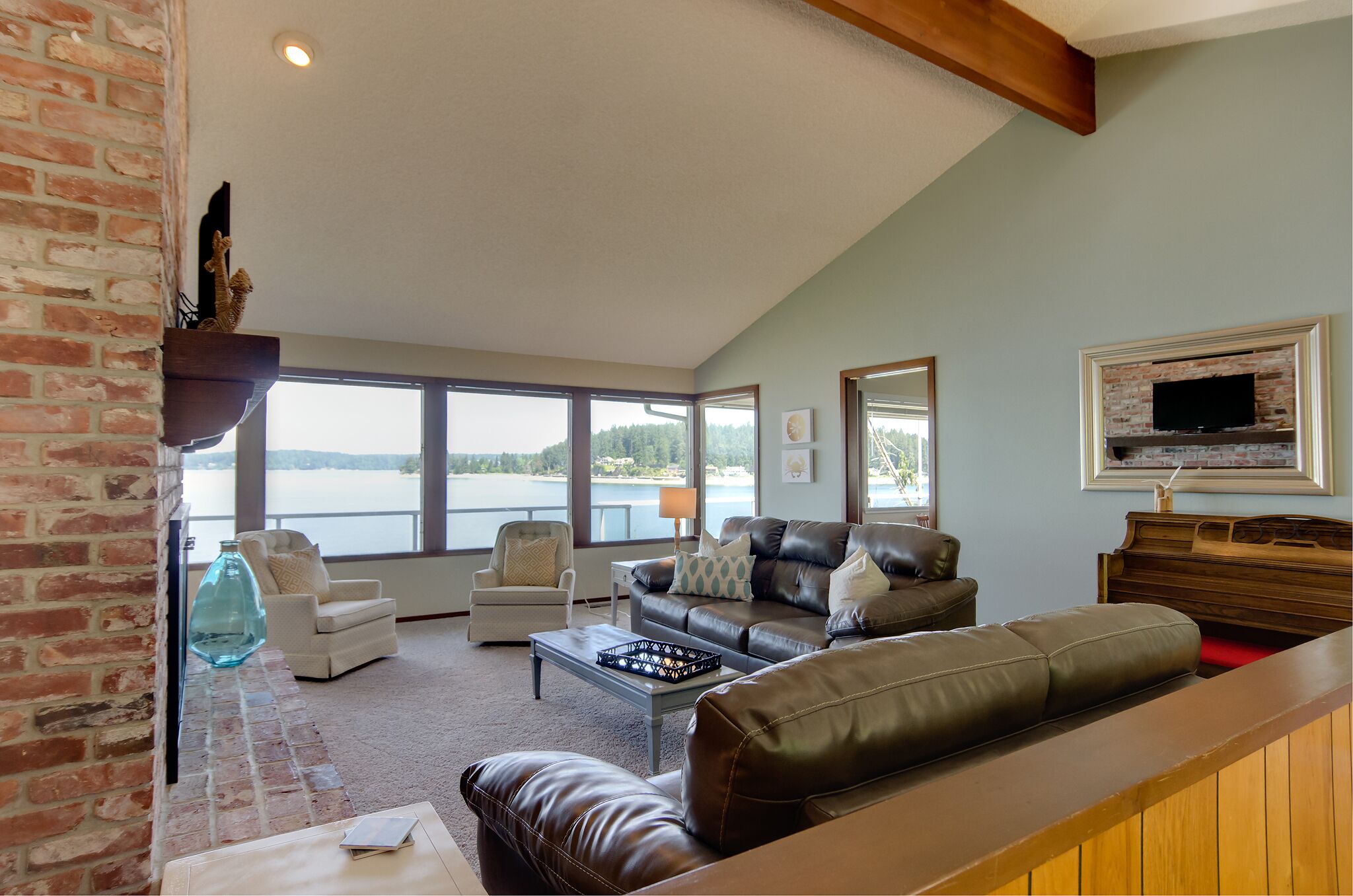 Panoramic views of the Olympic Mtns, waterfront beach and paddleboards