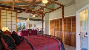 A bedroom with a canopy bed, a desk, and a view of the outdoors. - Oceanview, Walk to Poipu Beach, AC, Private Lanai! (Koloa)