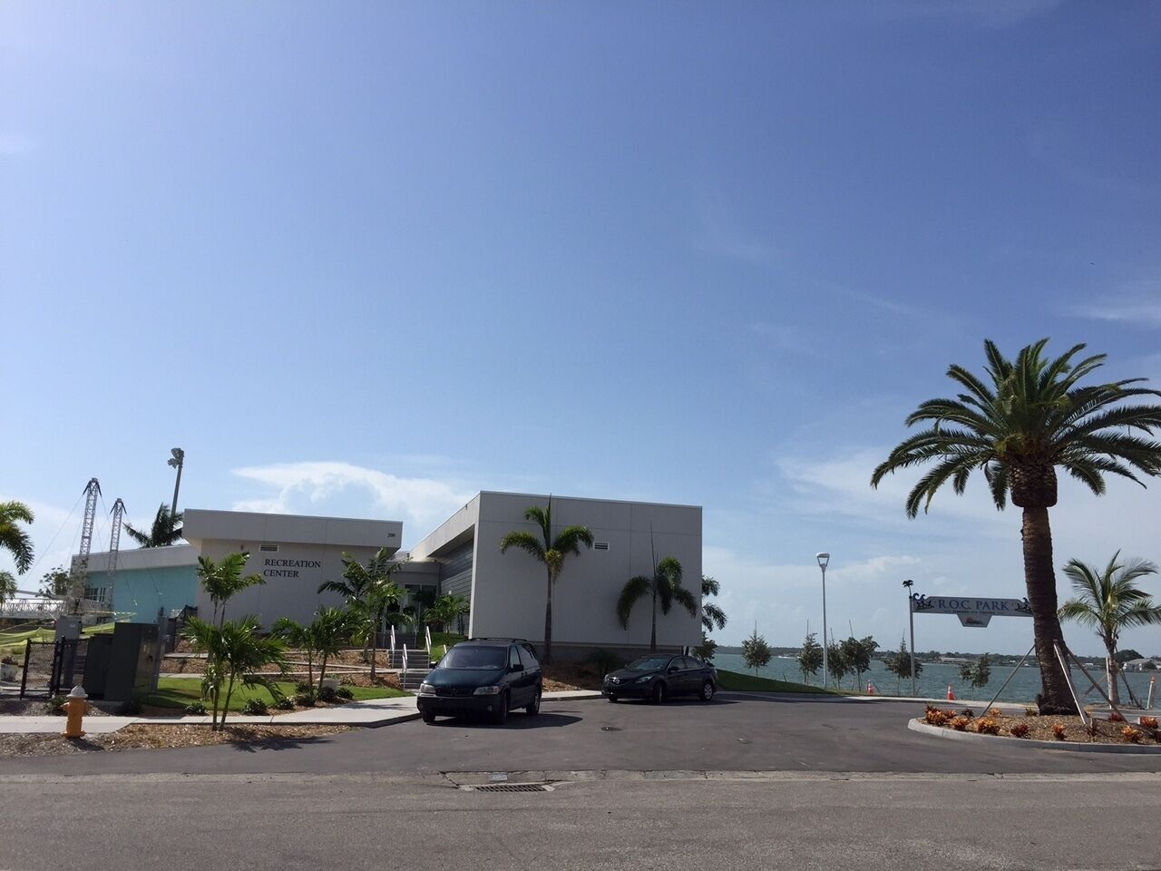 A parking lot with a building labeled 'RECREATION CENTER' and a sign for 'MARLON PARK.'