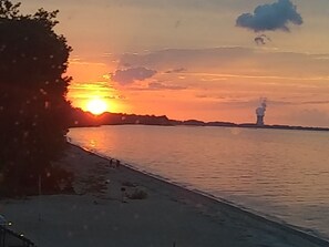 On the beach, sun loungers