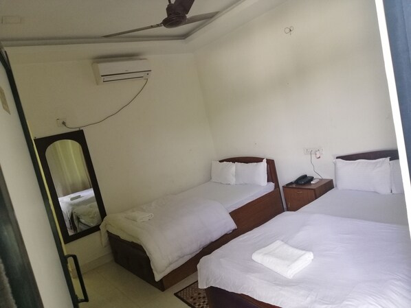 Family Suite, 2 Queen Beds, Pool View, Ground Floor | Free WiFi, bed sheets - Hotel Suramma (Lumbini)