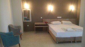 Select Comfort beds, desk, laptop workspace, iron/ironing board