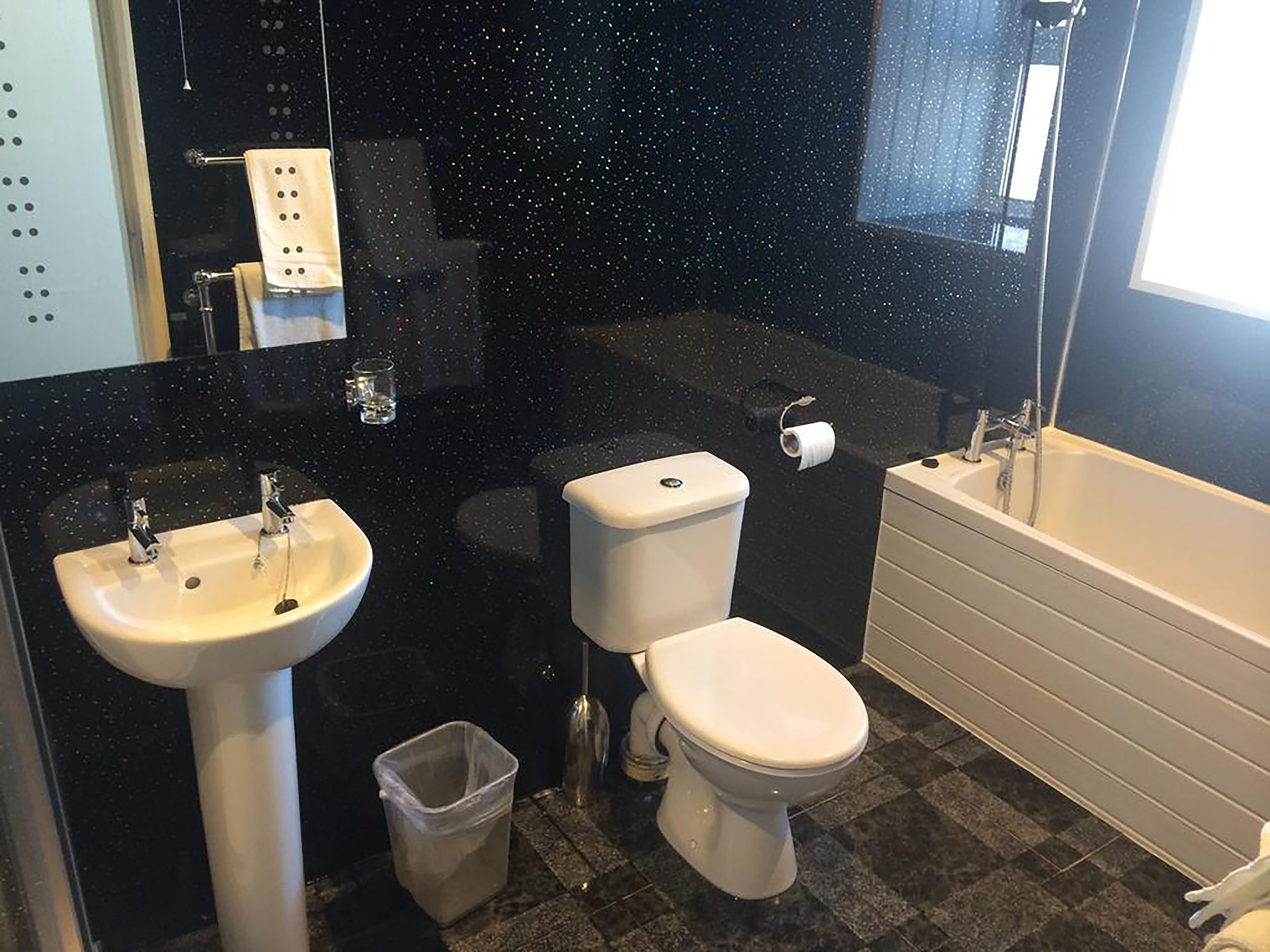 deluxe king room | bathroom | free toiletries, hair dryer, towels