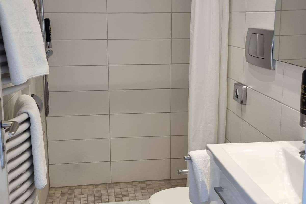 classic double room | bathroom | hair dryer, towels, soap, shampoo