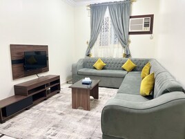 Apartment, 2 Bedrooms | Living area | Flat-screen TV