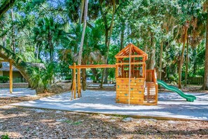 Explore the park's playground, featuring a climbing wall and slide.