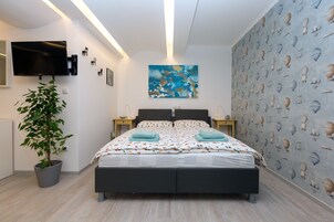 Standard Apartment | Desk, blackout drapes, soundproofing, iron/ironing board