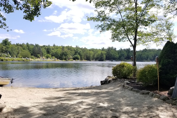 Private beach with beach chairs, 2 kayaks, rowboat, and canoe for your use.