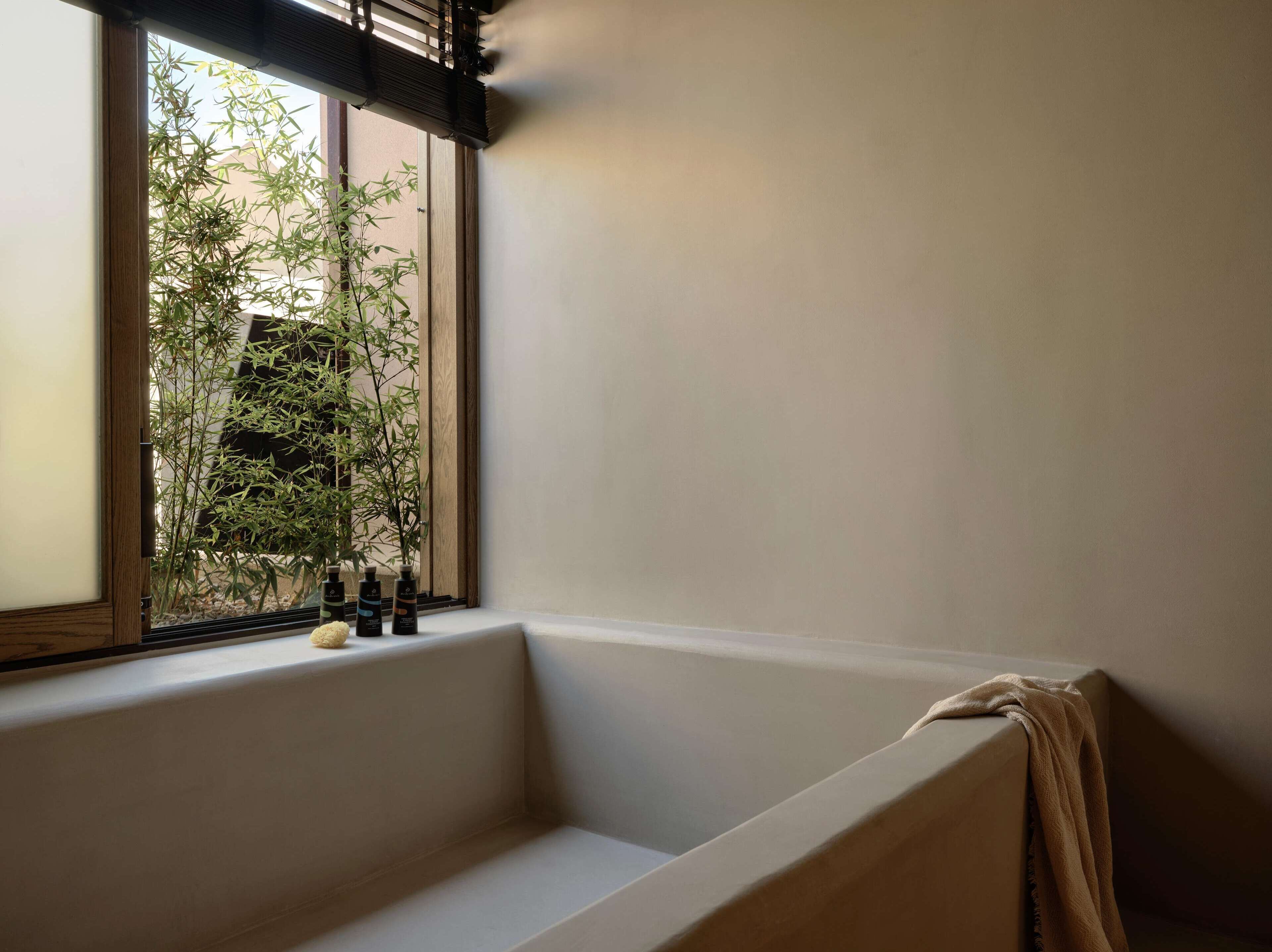 combined shower/bathtub, designer toiletries, hair dryer, bathrobes