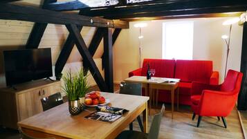 Superior Apartment | Living area | 43-inch flat-screen TV with satellite channels, TV, heated floors