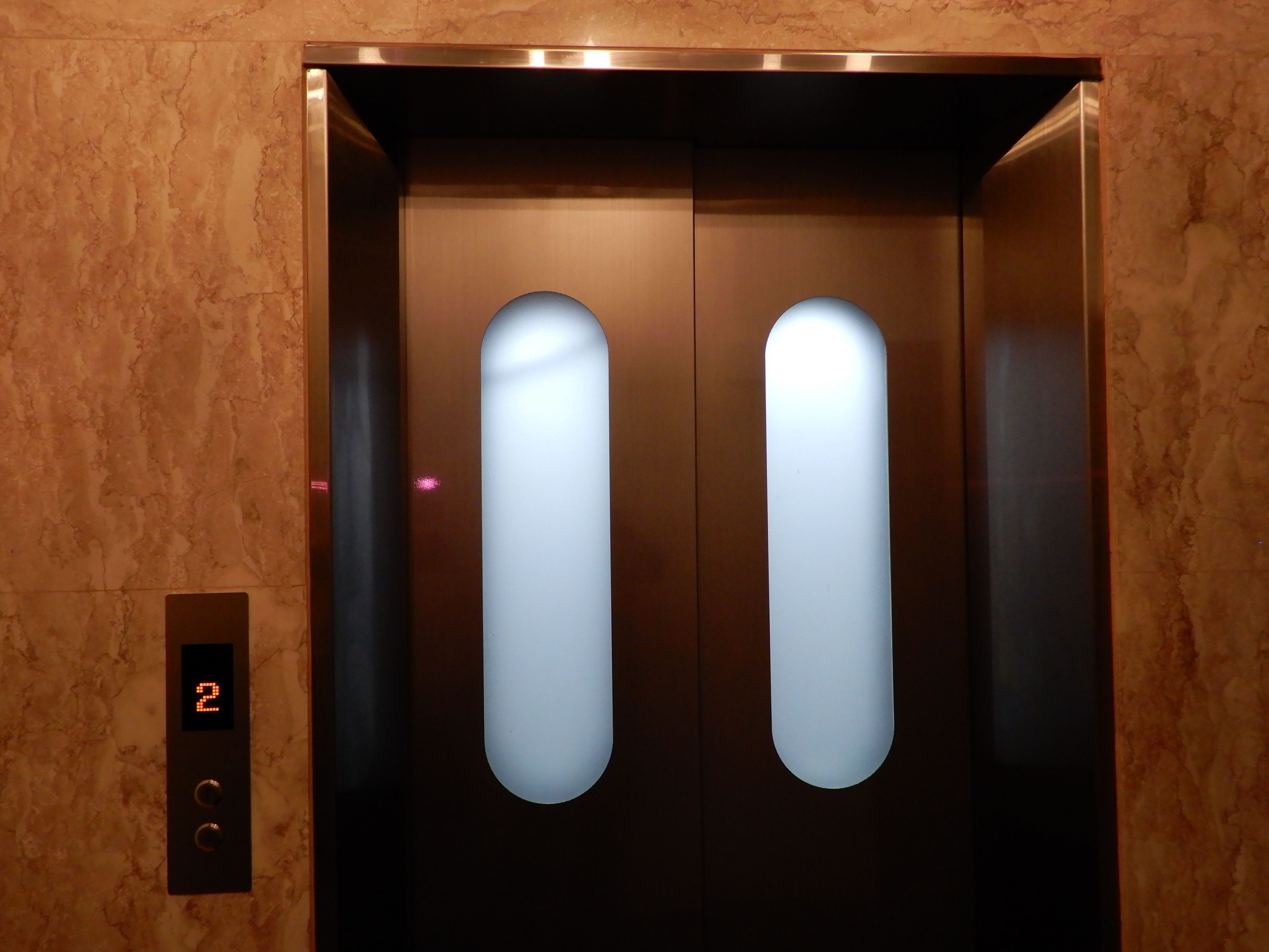 An elevator with a digital display showing the number 2, indicating the floor.