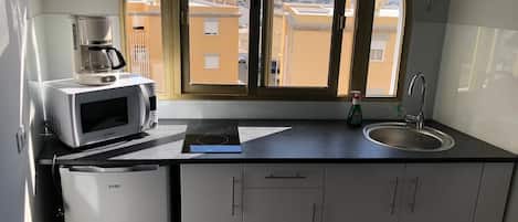 Fridge, microwave, stovetop, coffee/tea maker