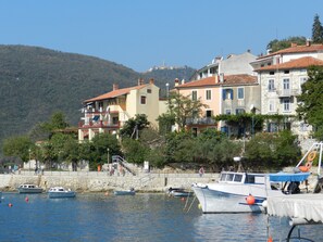 Stunning coastal town nestled between hills and waterfront.