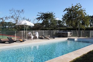 Seasonal outdoor pool, open 10:30 AM to 7:00 PM, pool umbrellas