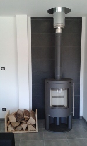 Cozy warmth is at your fingertips with this compact wood-burning stove.