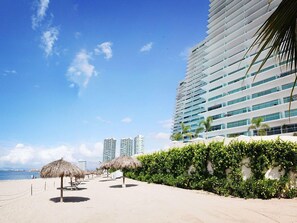 On the beach, sun-loungers, beach towels