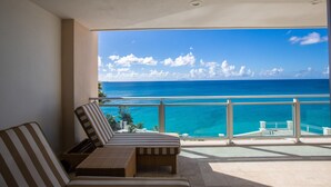A balcony with a view of the ocean and a clear sky. - The CLIFF - Renovated Condo in a Luxury Beachfront Resort with Spa - Restaurant (Cupecoy)