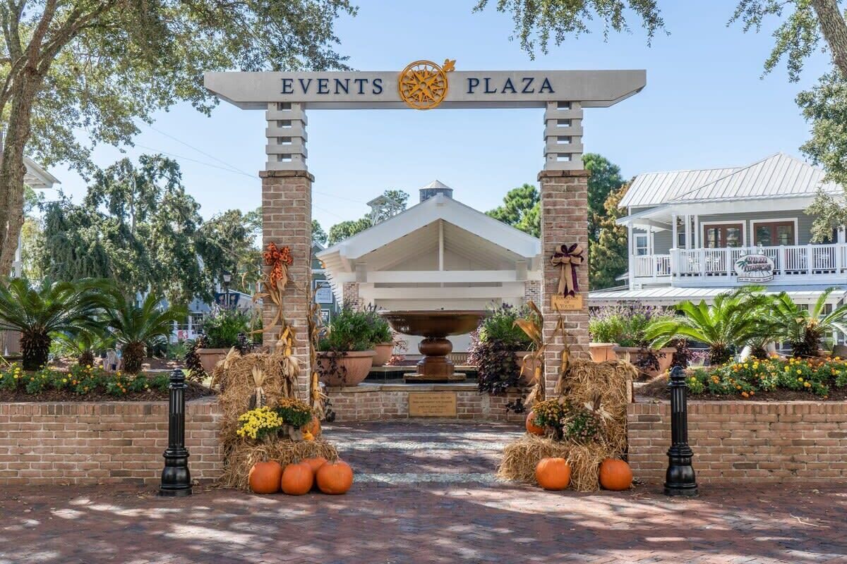 The entrance to Events Plaza with a gazebo and decorative pumpkins.