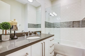 Combined shower/bathtub, hair dryer, towels, soap