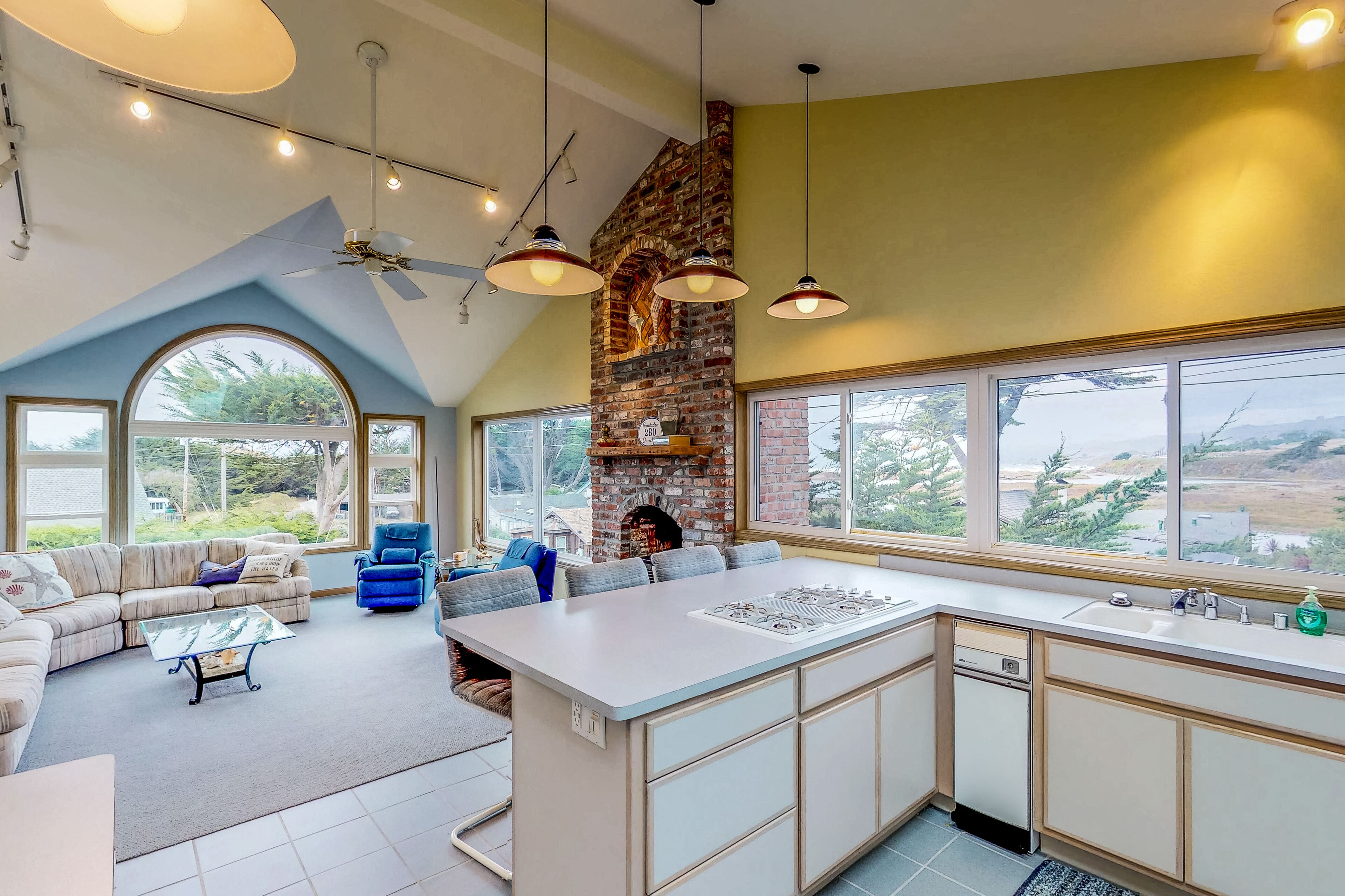 Ocean view home with private sauna, fireplace, balcony & W/D - walk to beach