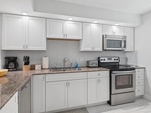 Coffee/tea maker, fridge, microwave, oven