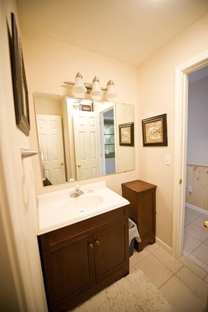 Combined shower/bathtub, towels, soap, toilet paper