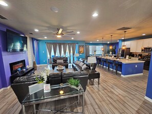 Smart TV, DVD player, foosball, music library