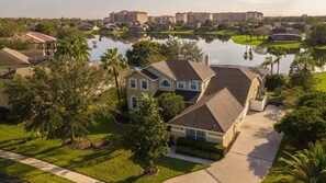 A residential area with houses, a lake, and a golf course.
