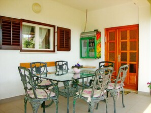 Enjoy meals in this dining area with a glass-top table and six comfortable chairs.
