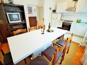 Fridge, microwave, toaster, cookware/dishes/utensils