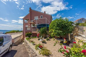 Enjoy a peaceful stay with a balcony overlooking a beautifully maintained garden.