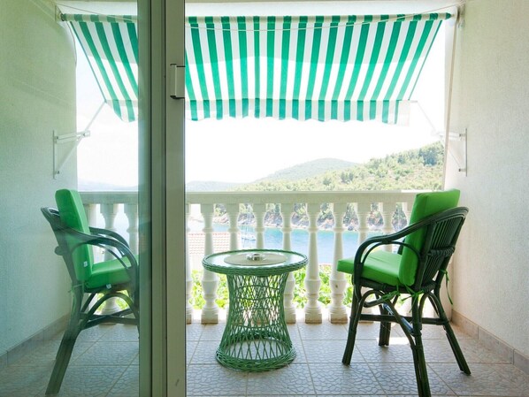 Enjoy breathtaking views of the surrounding mountains from this balcony.
