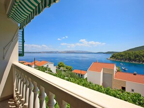 Enjoy breathtaking views of the coastal area from this balcony.