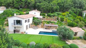 A two-story house with a swimming pool, surrounded by lush greenery and a well-maintained lawn. - This place is magic in the wonderful village of La Garde Freinet. (La Garde-Freinet)