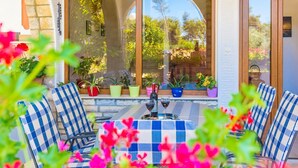 A patio with outdoor seating and potted plants. - Apartments Blanka, (14958), Privlaka, hr (Privlaka)