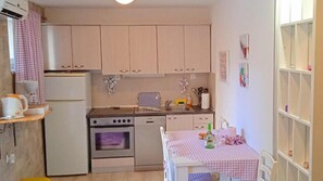 Fridge, microwave, toaster, cookware/dishes/utensils