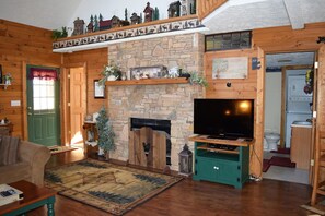 Cabin, Multiple Beds (Higher Ground) | Living room | Fireplace