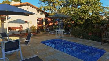 Outdoor pool, open 8:00 AM to 10:00 PM, pool umbrellas, pool loungers