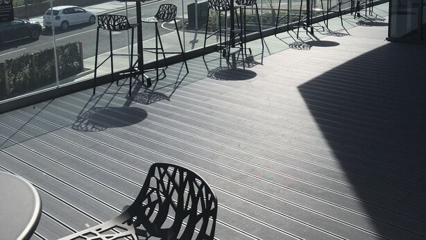 A terrace with outdoor seating, a view of a road, and a building labeled "Stockto. Baptist Church" in the background. - Hampton by Hilton Stockton on Tees (Stockton-on-Tees)