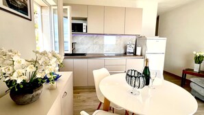 Fridge, microwave, cookware/dishes/utensils