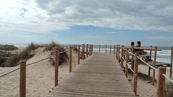 On the beach, sun-loungers, beach towels