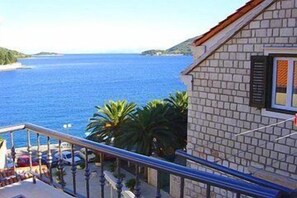 Enjoy breathtaking views of the sea from this coastal retreat's spacious balcony.