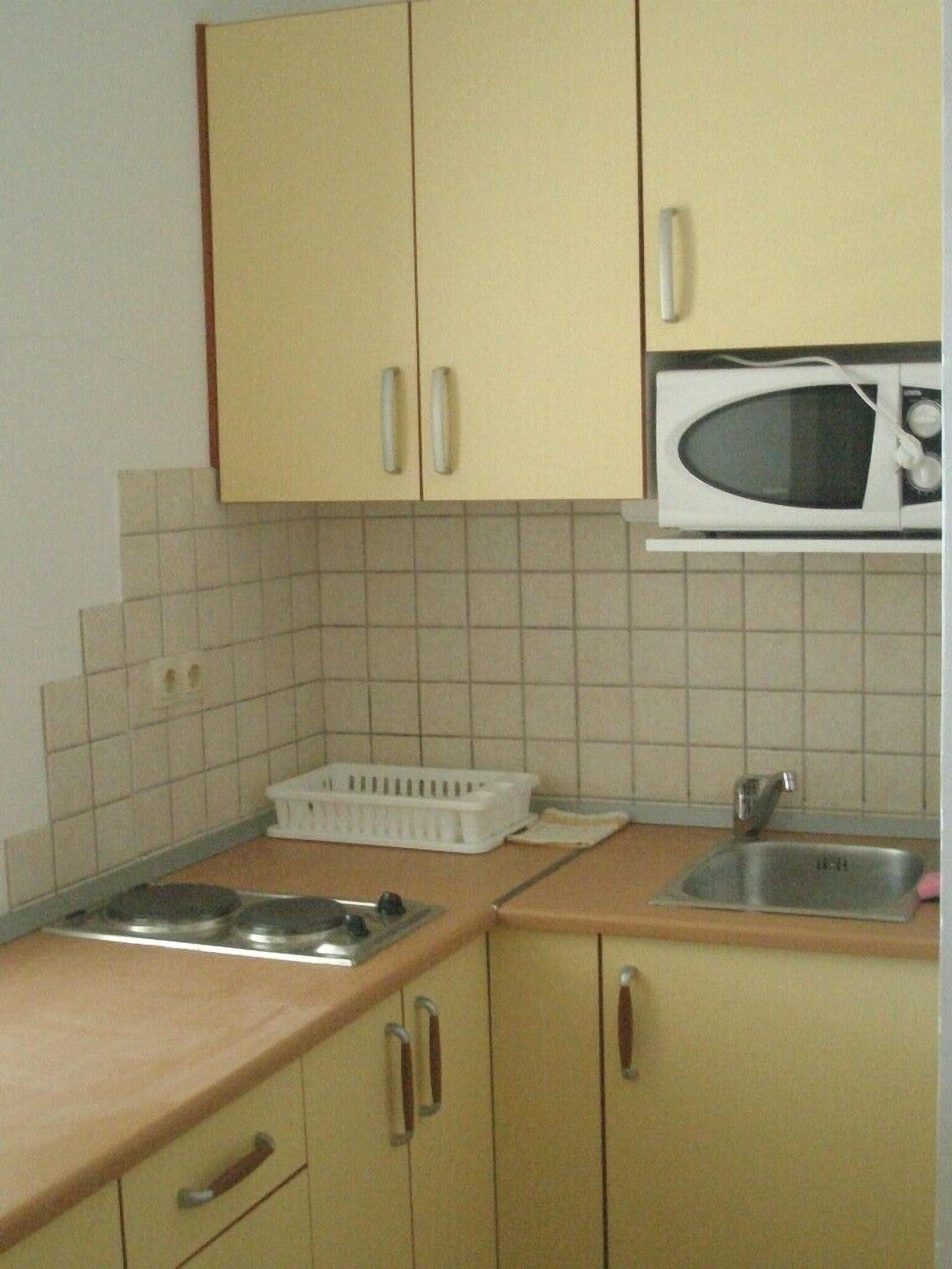Fridge, microwave, cookware/dishes/utensils