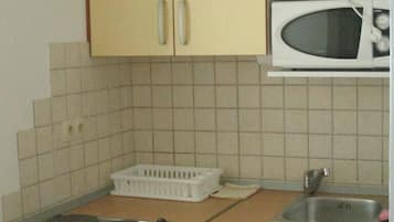 Fridge, microwave, cookware/dishes/utensils