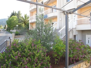 Enjoy a balcony with garden views from this residential building.