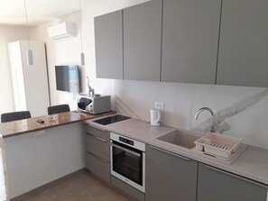 Fridge, microwave, toaster, cookware/dishes/utensils